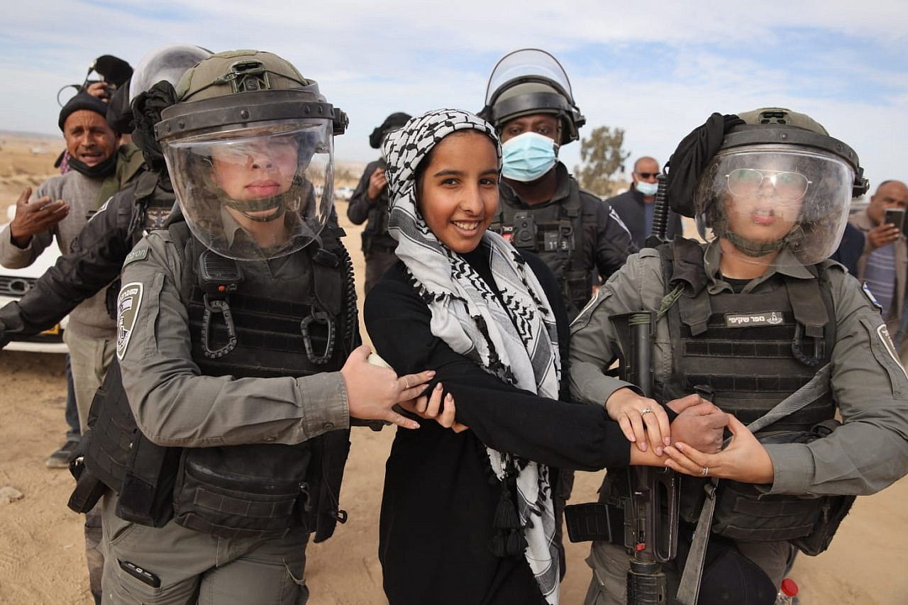 Israeli police arrest a Bedouin protester in the village of as-Sa’wa al-Atrash in the Naqab/Negev, January 13, 2022. (Oren Ziv)