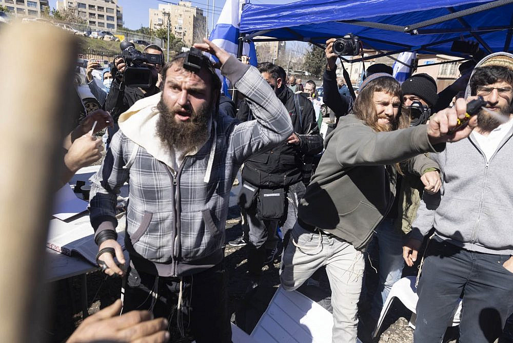 Settlers attack Palestinians in the Jerusalem neighborhood of Sheikh Jarrah after far-right MK Itamar Ben Gvir set up a makeshift parliamentary office in front of the Salem family home on February 13, 2022. The Salem's are under imminent threat of expulsion. (Oren Ziv)