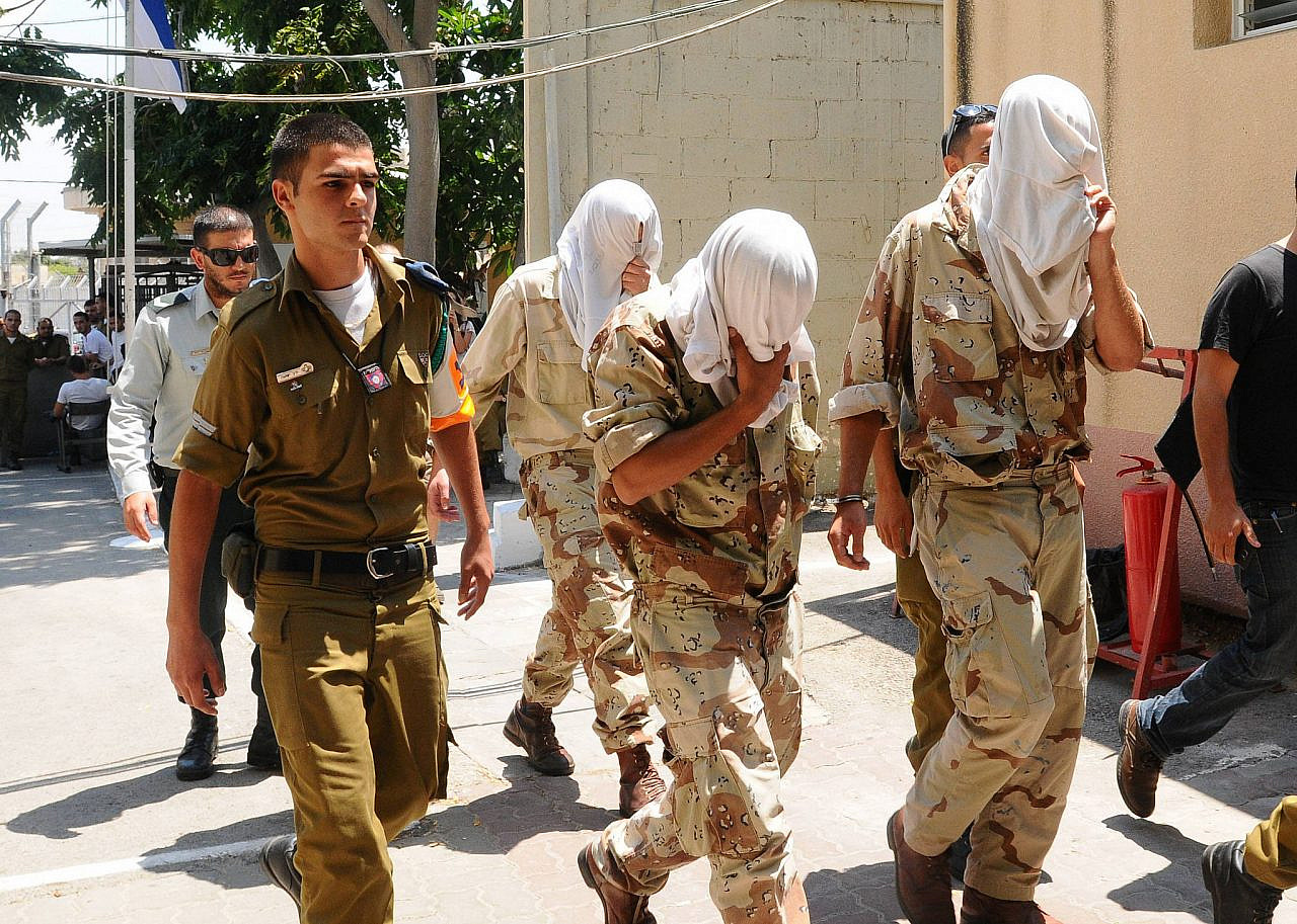 Suspects from the Kfir Brigade, accused of injuring a recruit during a hazing ritual, arrive for their court hearing in Jaffa, August 5, 2012. (Yossi Zeliger/Flash90)