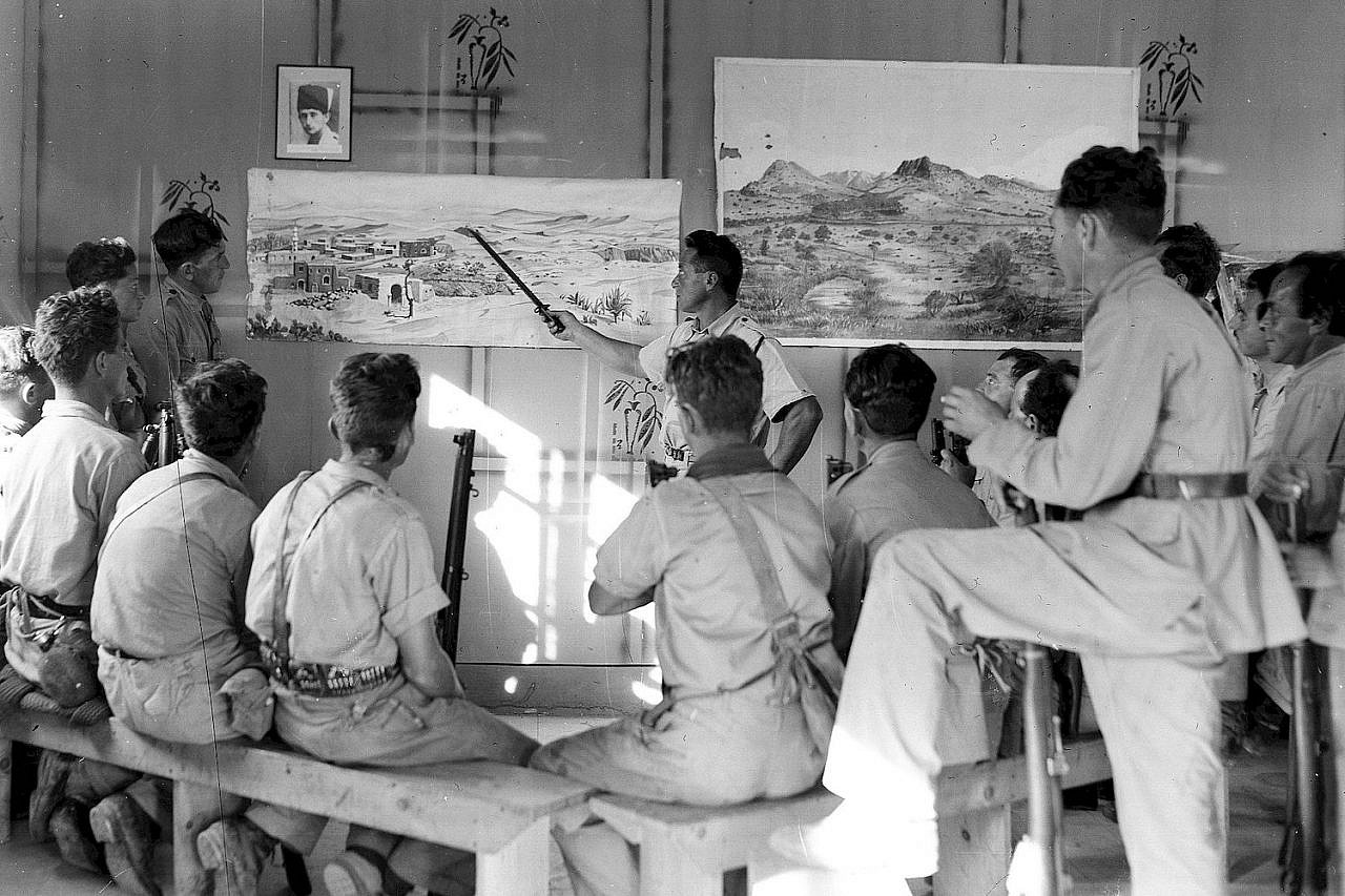 Fighters in the Haganah, the prominent pre-state Zionist paramilitary group, get a lesson in topography, near Sheikh Bureik in northern Palestine, December 24, 1938. (GPO)