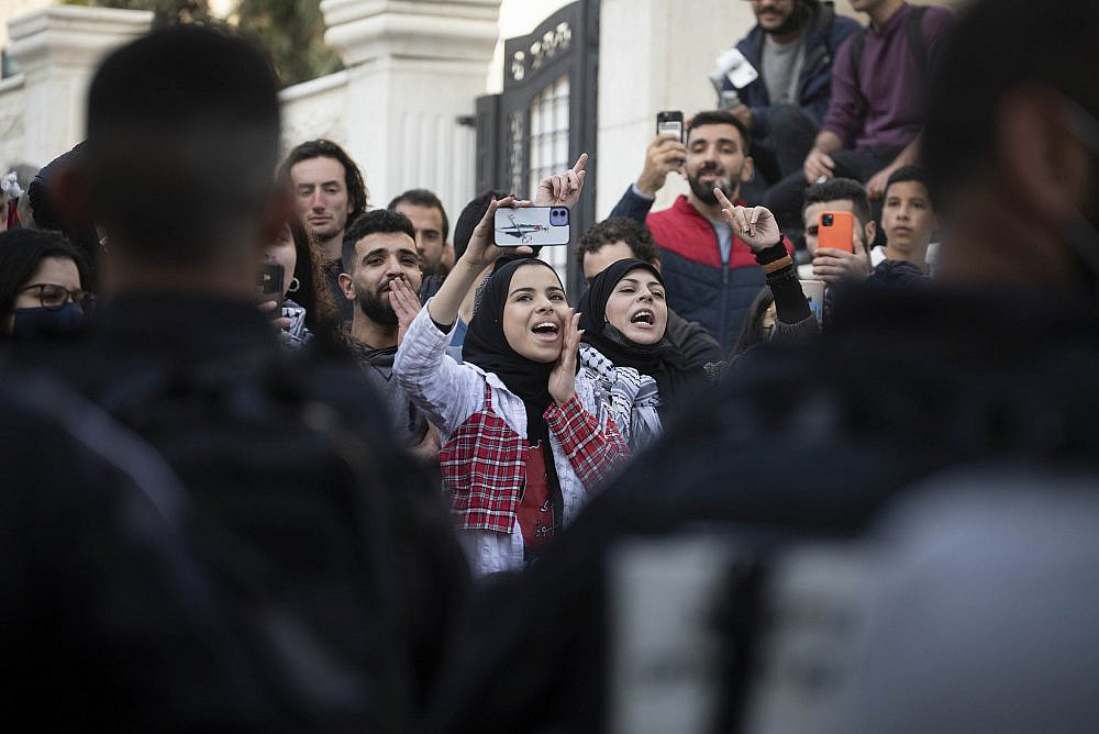 Palestinians and left-wing activists protest during the Friday weekly demonstration in the Sheikh Jarrah neighborhood, Jerusalem, February 18, 2022. (Oren Ziv/Activestills