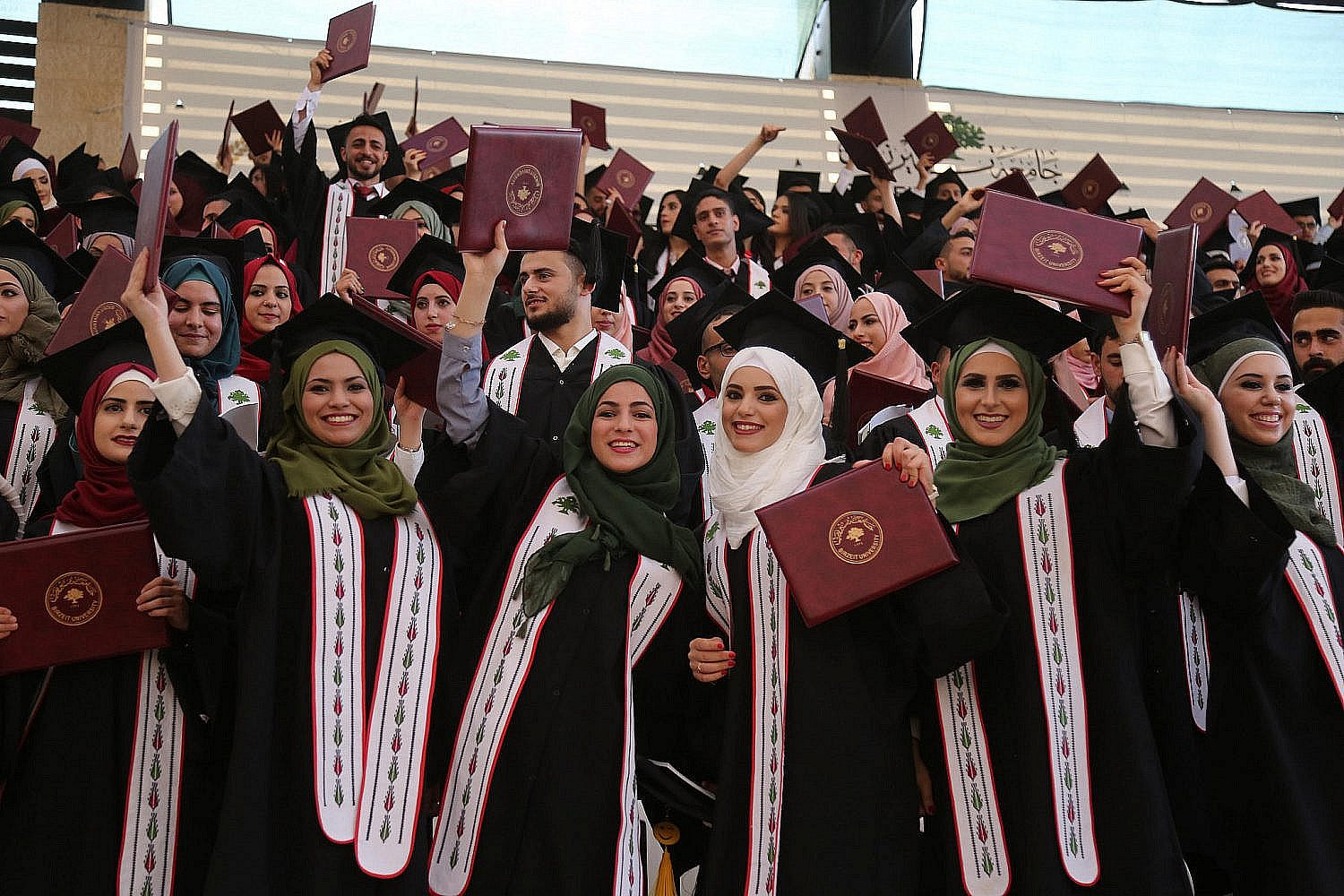 Palestinian students attend their graduation ceremony at the end of the academic year at Birzeit University in the West Bank town of Birzeit, near Ramallah, July 2, 2017. (Flash90)
