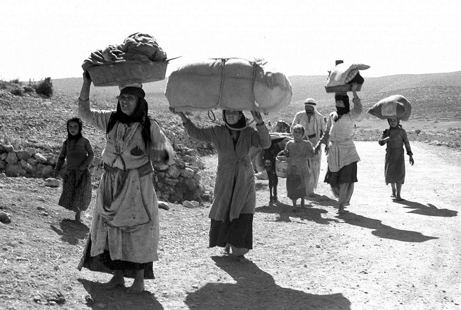 Palestinians flee their village in the Galilee after the entry of Zionist forces, 1948. (GPO)