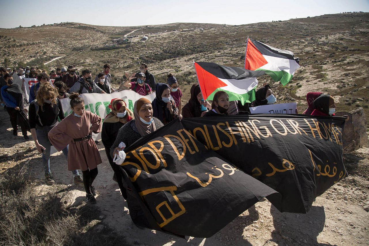 Protesters march in A-Rakeez in the Masafer Yatta region of the South Hebron Hills after Israeli soldiers shot 24-year-old Harun Abu Aram in the neck, January 8, 2021. (Keren Manor/Activestills.org)