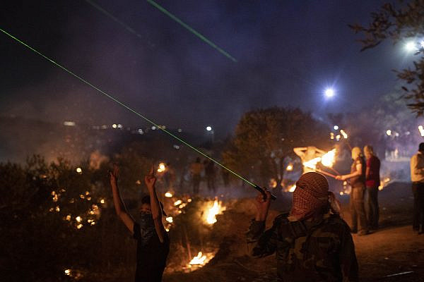 Palestinian residents of the West Bank town of Beita hold nightly protests against the settlement of Eviatar built on their lands, June 29, 2021. (Oren Ziv/Activestills)