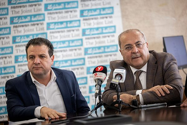 MK Ayman Odeh, head of the Joint List, and MK Ahmad Tibi attend a faction meeting at the Knesset in Jerusalem, March 7, 2022. (Yonatan Sindel/Flash90)