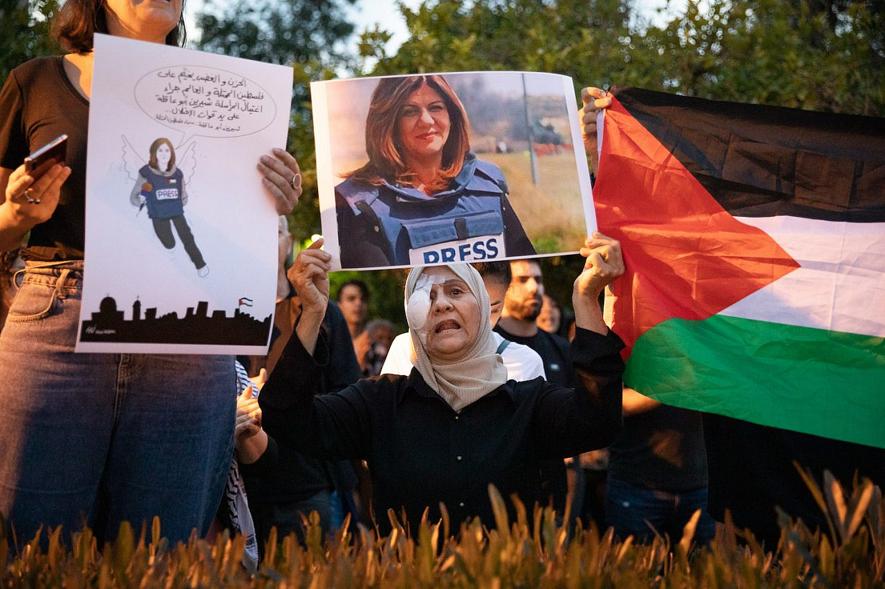 Palestinians hold a vigil following the killing of Al Jazeera journalist Shireen Abu Akleh, Haifa, May 11, 2022. (Shir Torem/Flash90)
