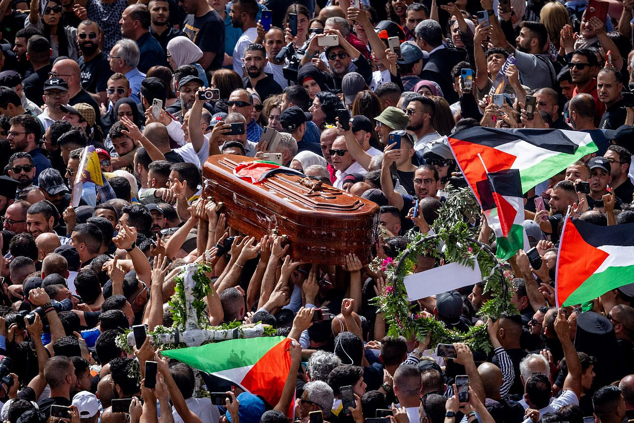 People carry the coffin of Al Jazeera journalist Shireen Abu Akleh during her funeral at Jaffa Gate in Jerusalem's Old City, May 13, 2022. (Yonatan Sindel/Flash90)
