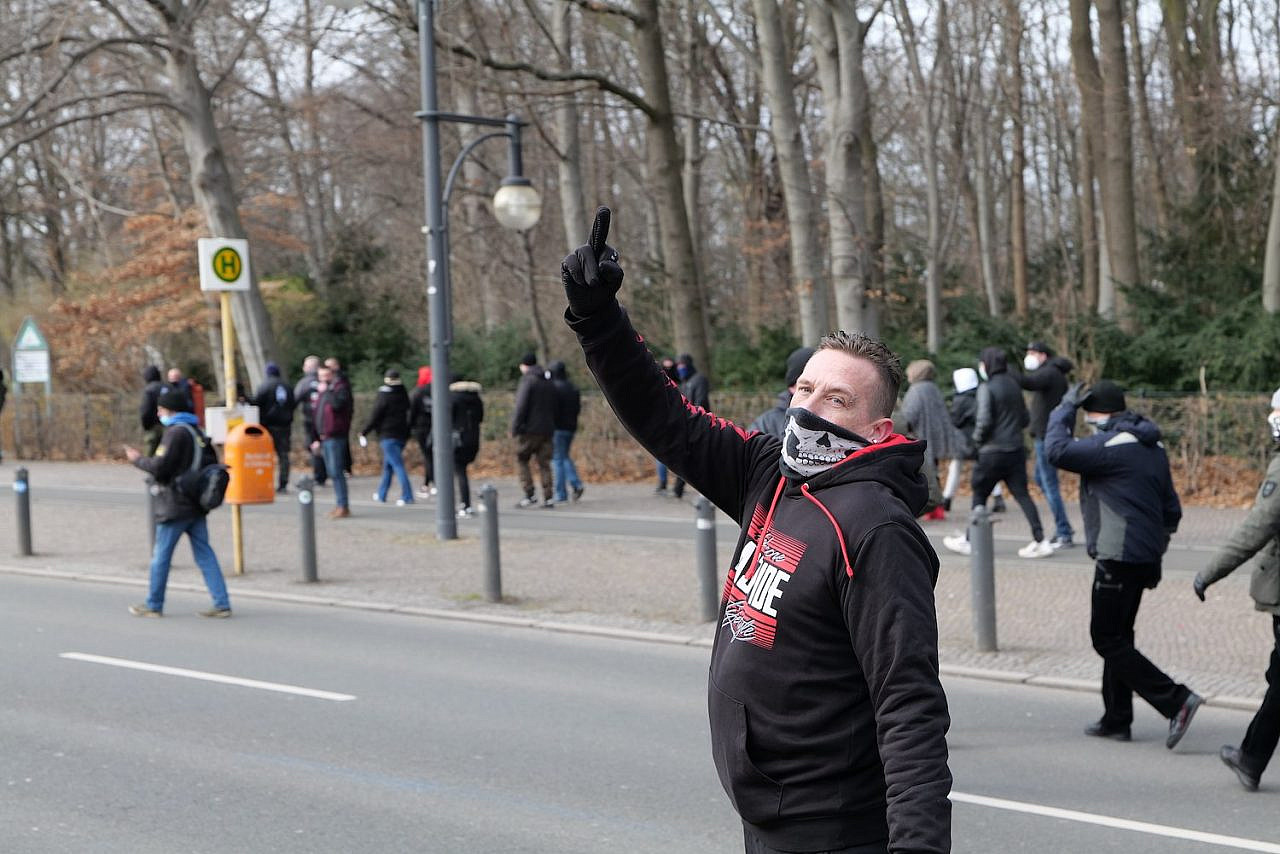 Far-right Germans, protected by police, take part in a demonstration by neo-Nazi, monarchist, and COVID conspiracy theorist groups in Berlin, March 20, 2021. (Leonhard Lenz)
