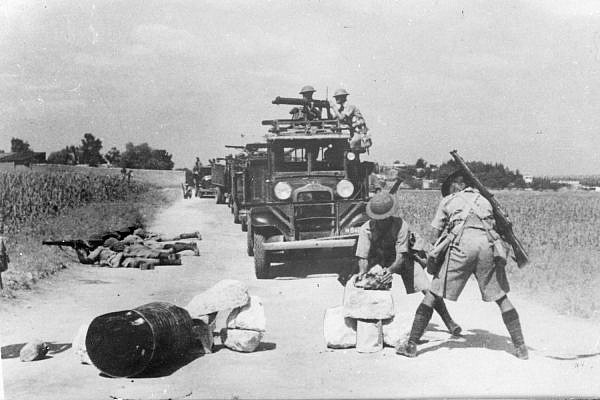 British soldiers clear an improvised roadblock during the Arab Revolt. (Yad Izhak Ben-Zvi archives)