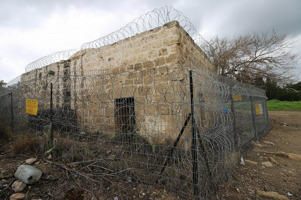 The fenced off maqam and mosque of the depopulated village of Sheikh Ibriq, east of Haifa. (Ahmad Al-Bazz)