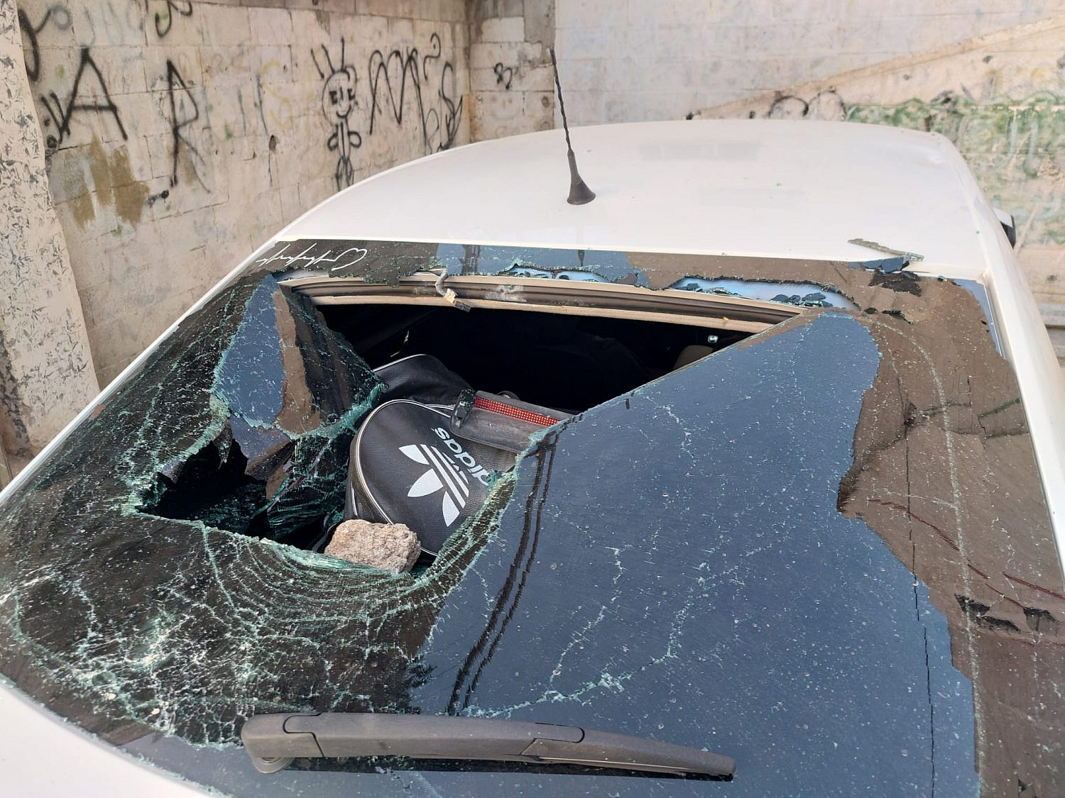 Cars belonging to Palestinian residents damaged by Israeli extremists during the Flag March on Jerusalem Day, May 29, 2022. (Oren Ziv)