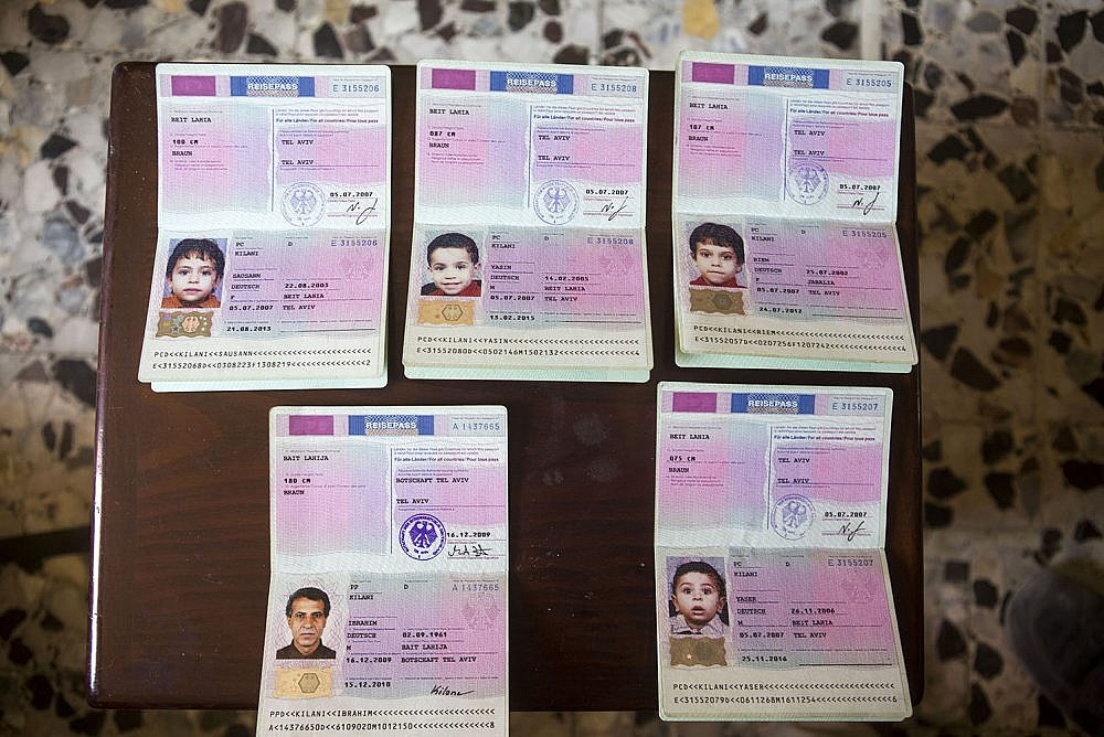 The German passports of Ibrahim al Kilani and four of his children, seen in their home in Beit Lahiya, Gaza Strip, September 18, 2014. Ibrahim was killed together with his wife Taghrid and their five children in an Israeli attack on July 21, 2014, targetting the building where they took refuge in Gaza City. (Anne Paq/Activestills)