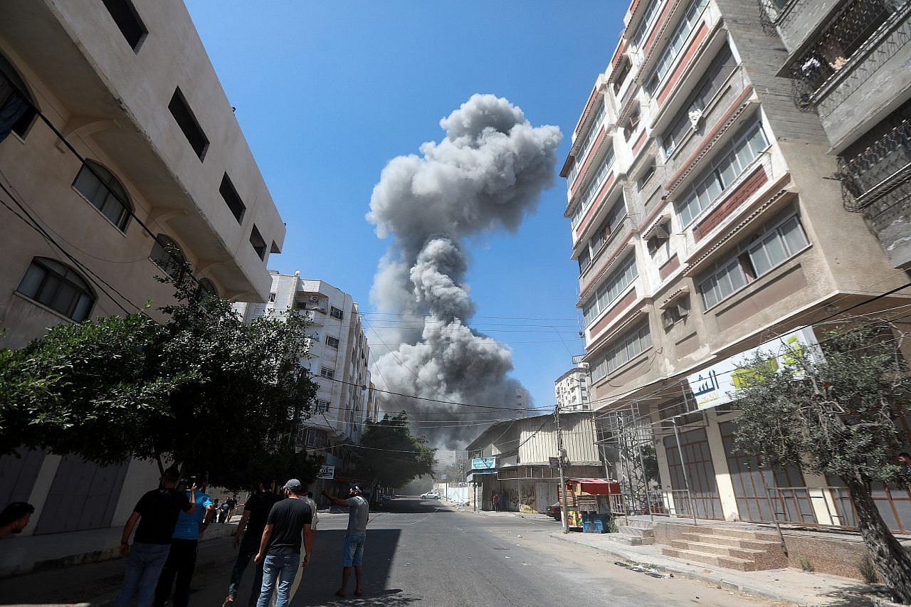 Smoke billowing following Israeli airstrikes in Gaza City, Gaza Strip, May 16, 2021. (Mohammed Zaanoun/Activestills)