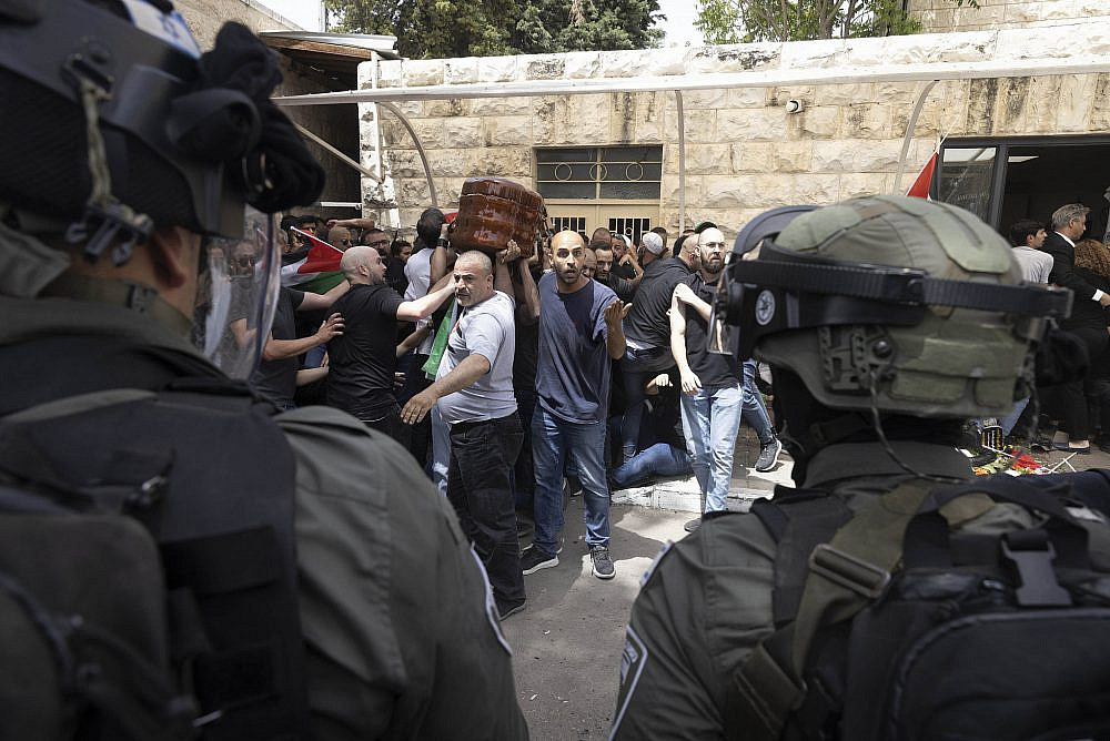 Israeli police attack the funeral of journalist Shireen Abu Akleh at Saint Joseph Hospital in Jerusalem, May 13, 2022. (Oren Ziv/Activestills)