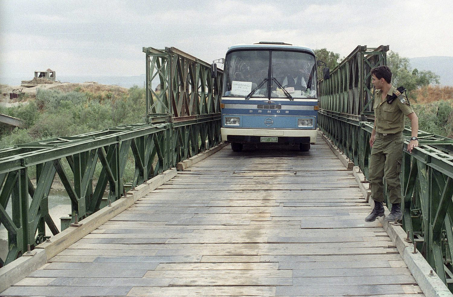 A bus crosses the Allenby Bridge / King Hussein Bridge which connects Jericho in the West Bank to Jordan. (Flash90)