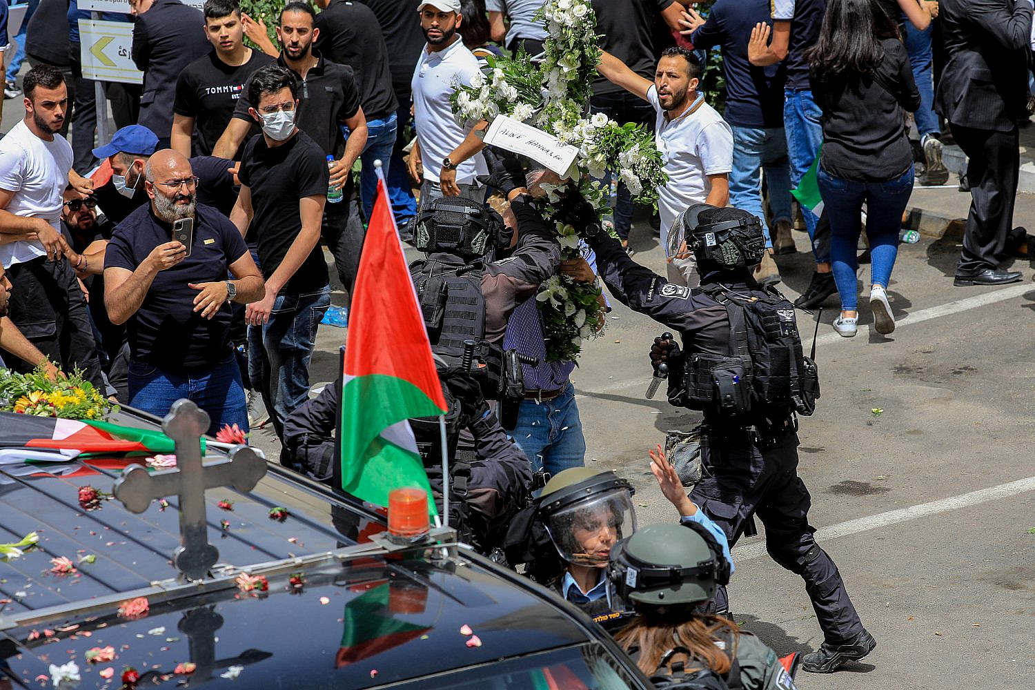 Mourners gather for the funeral procession of Al Jazeera journalist Shireen Abu Akleh in Jerusalem's Old City, May 13, 2022. (Jamal Awadl/Flash90)