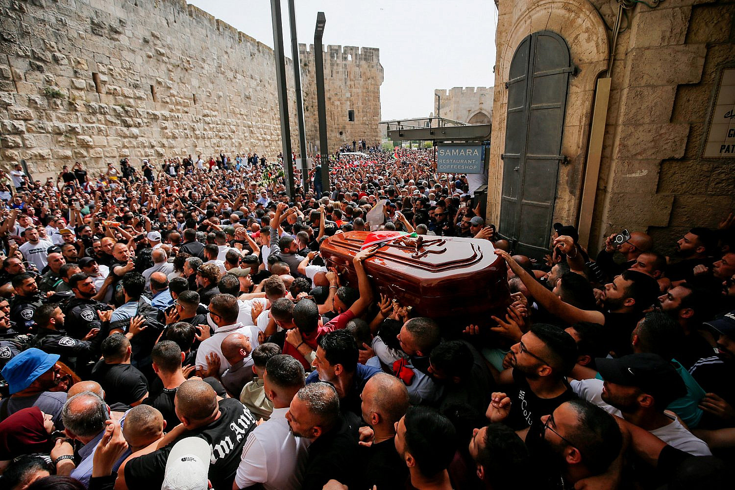 Mourners gather for the funeral procession of Al Jazeera journalist Shireen Abu Akleh in Jerusalem's Old City, May 13, 2022. (Jamal Awadl/Flash90)