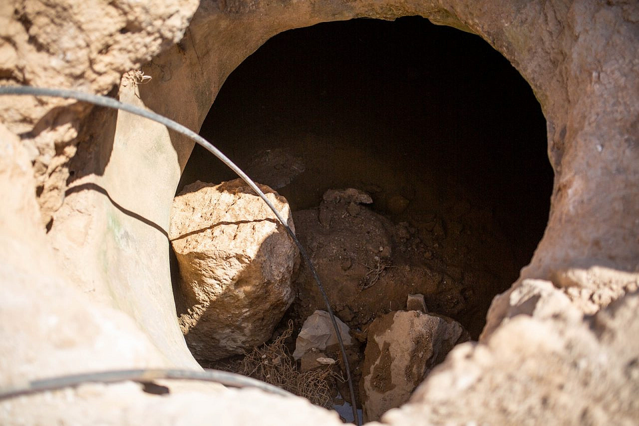 The Makhamreh family's well, full of large rocks that were tossed in by Israeli soldiers, June 22, 2022. (Emily Glick)