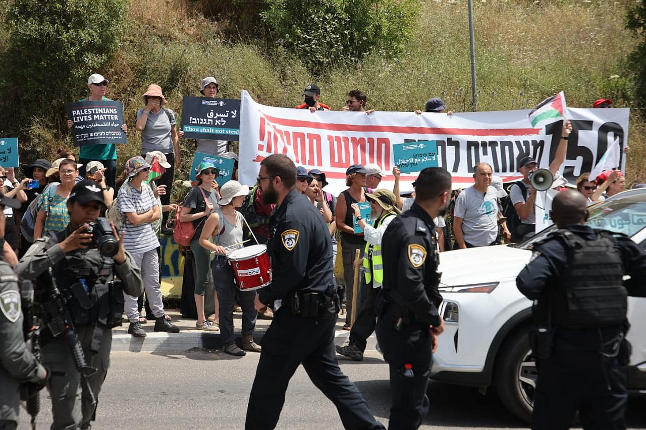 Left-wing Israeli activists protest outside the Kedumim settlement after the Israeli army and police blocked them from reaching the Homesh outpost, May 28, 2022. (Oren Ziv)