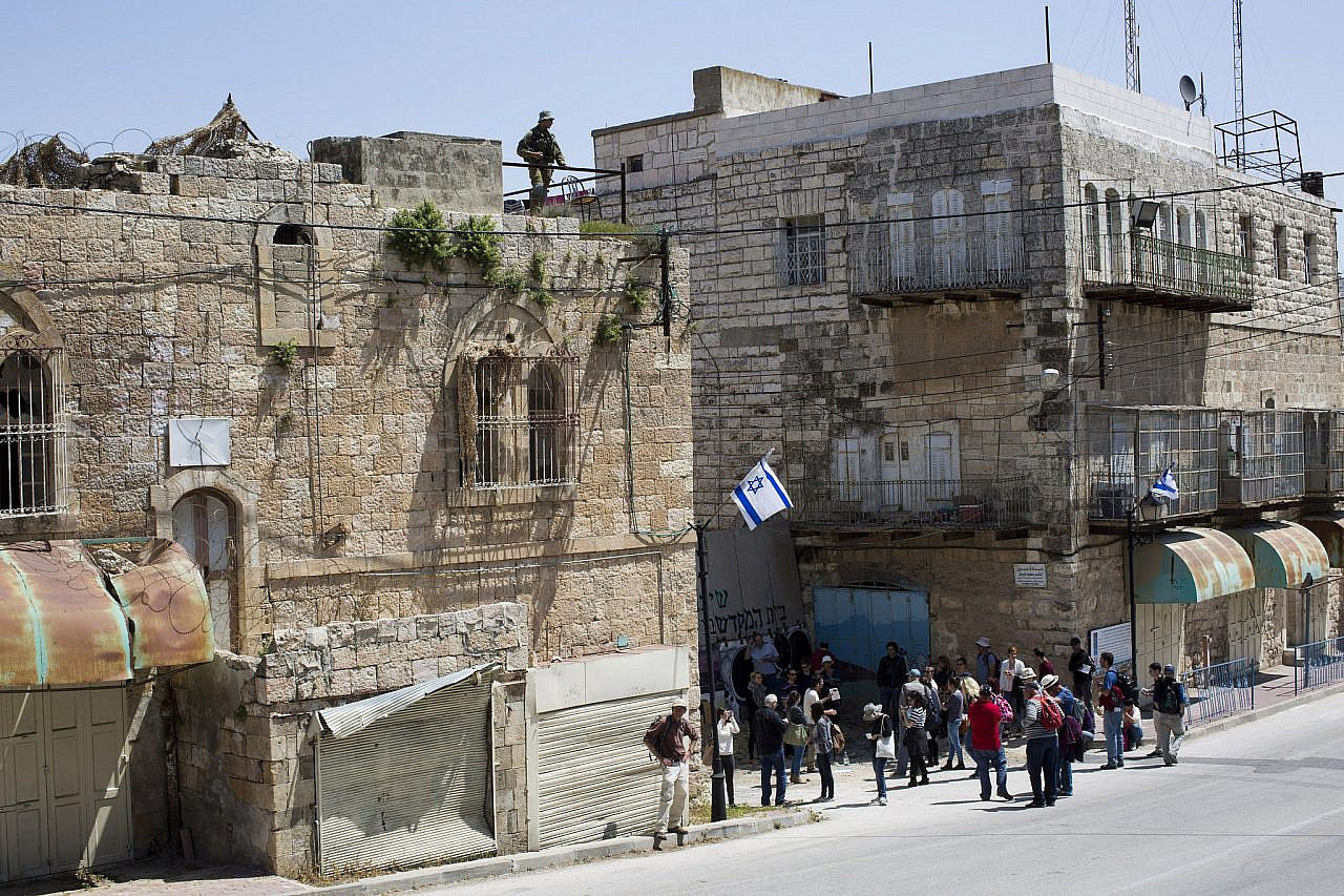Several dozen Israelis participate in a tour organized by Breaking the Silence in the Old City of Hebron, occupied West Bank, April 4, 2014. 