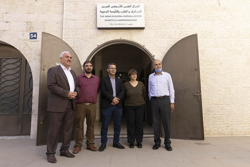 The directors of five Palestinian rights groups declared 'terrorist organizations' by Israel (L to R): Shawan Jabarin of Al-Haq, Ubai Al-Aboudi of Bisan Center, Fuad Abu Saif of UAWC, Sahar Francis of Addameer, and Khaled Quzmar of DCI-Palestine, in Ramalah, West Bank, October 28, 2021. (Oren Ziv)