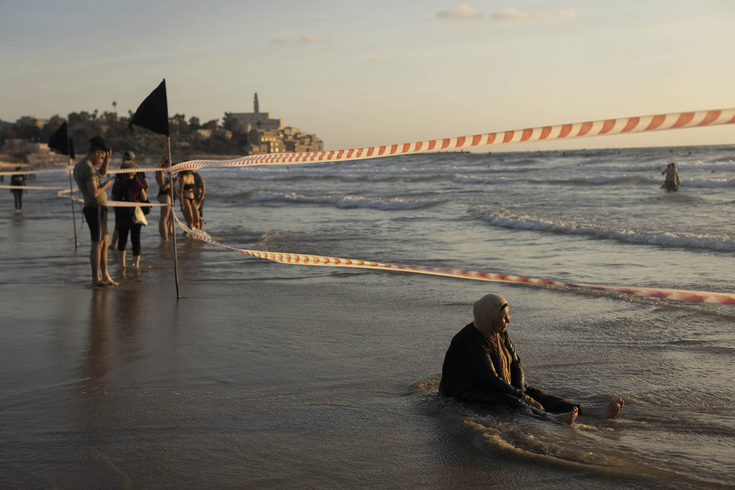 Palestinians from the West Bank enjoy the beach in Jaffa during the Eid al-Adha holiday, July 11, 2022. (Oren Ziv)