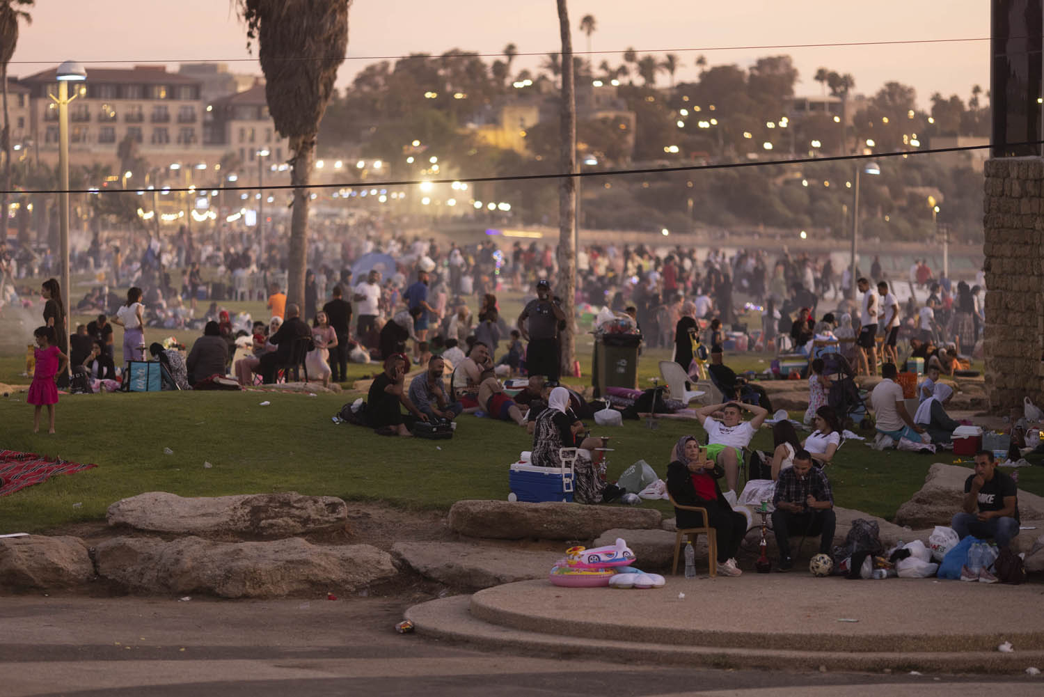 Thousands of Palestinians from the West Bank celebrate Eid al-Adha at the park next to Jaffa beach, July 11, 2022. (Oren Ziv)