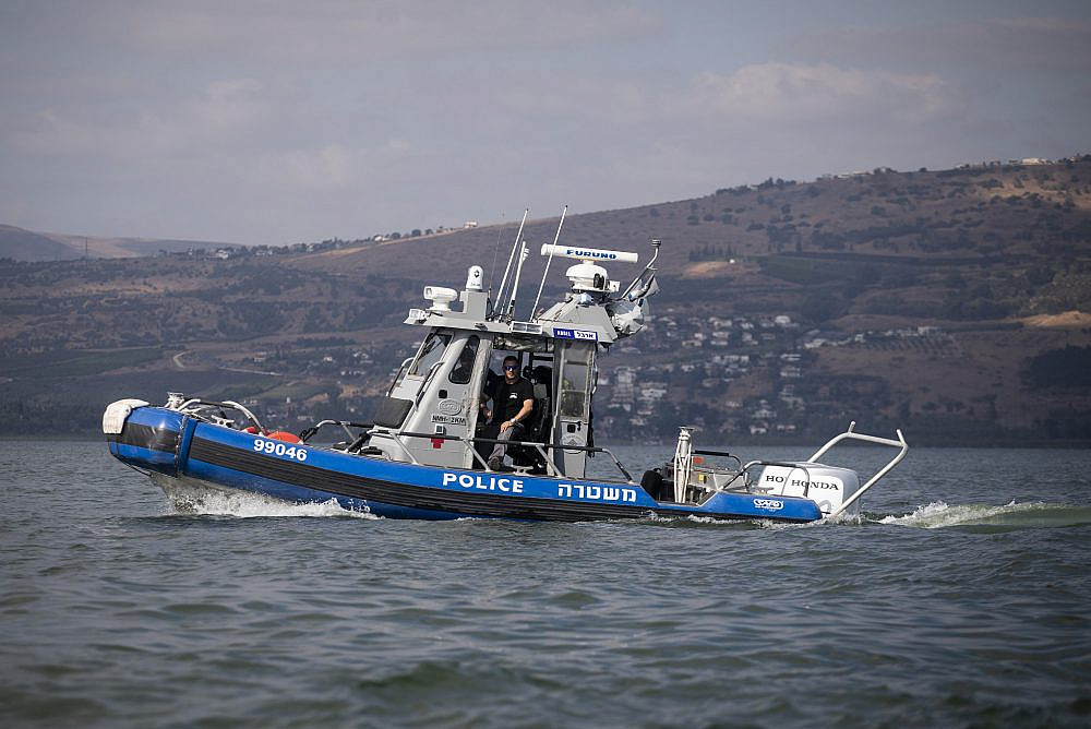 Israeli police patrol on a boat during the annual crossing of the Kinneret, the Sea of Galilea, September 21, 2019. (Hadas Parush/Flash90)