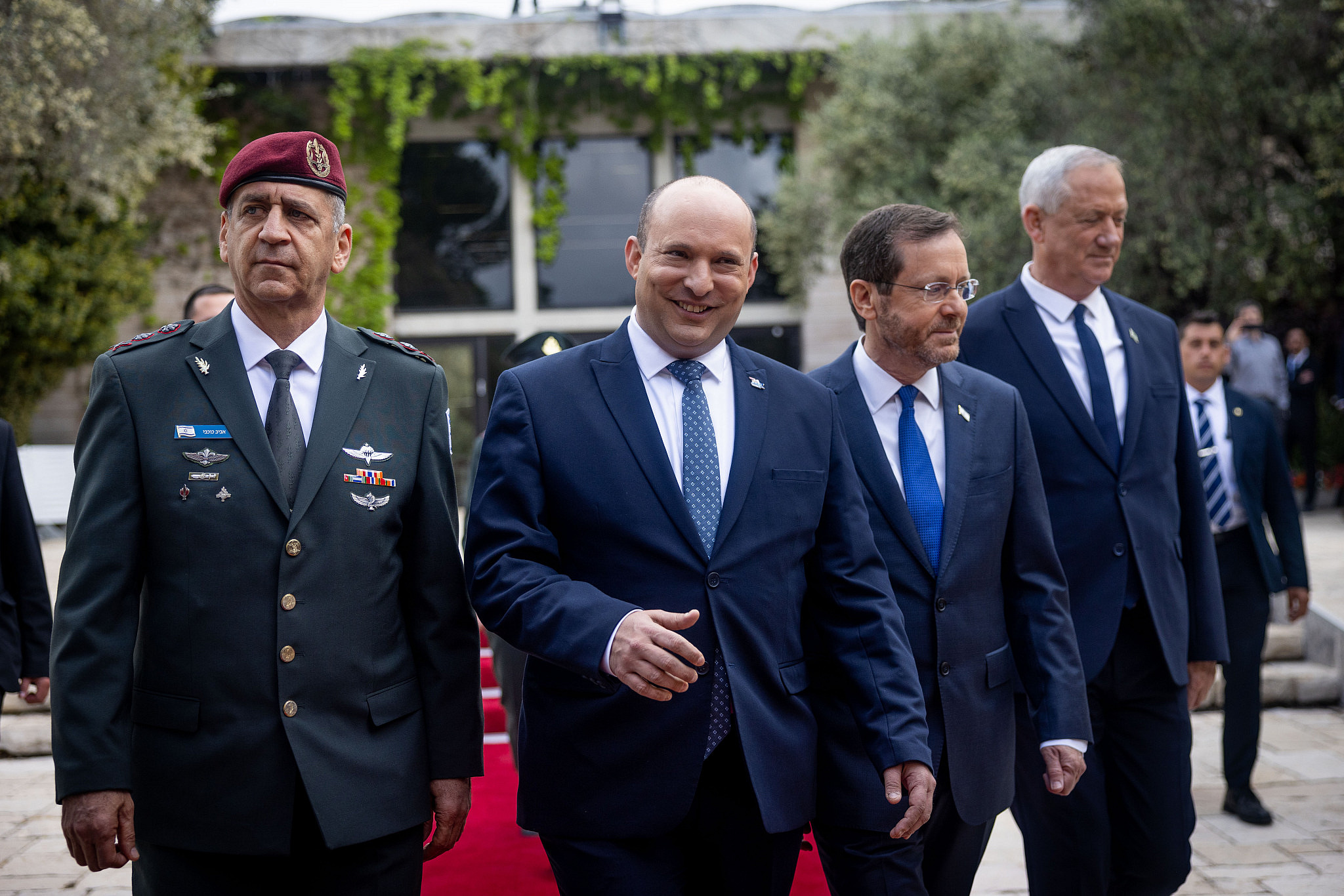 Israeli President Isaac Herzog, Prime Minister Naftali Bennett, Defense Minister Benny Gantz, and IDF Chief of Staff Aviv Kochavi at an event for outstanding soldiers as part of Israel's 74th Independence Day celebrations, at the President's residence in Jerusalem, May 5, 2022. (Yonatan Sindel/Flash90)