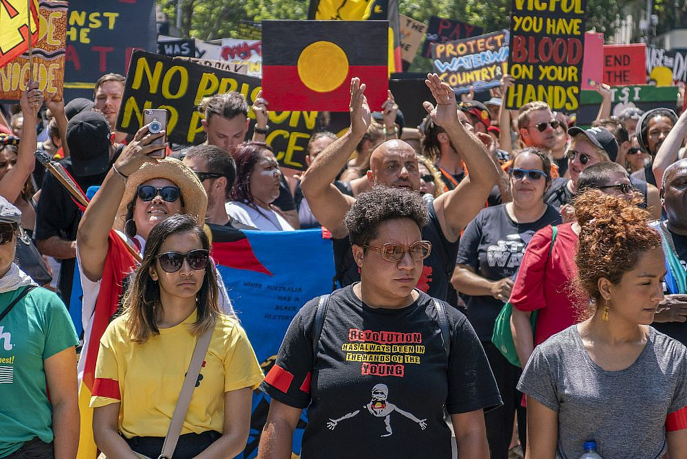 Protesters march in support of indigenous rights at the Invasion Day rally in Melbourne, Australia, January 26, 2020. (Flickr/Matt Hrkac/CC BY 2.0)