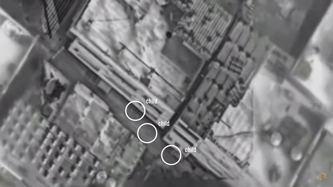 Screengrab showing aerial footage of the Gaza Strip with three children circled, from a video uploaded to the Israel Defense Forces YouTube account, titled 'IDF Strike Aborted'.