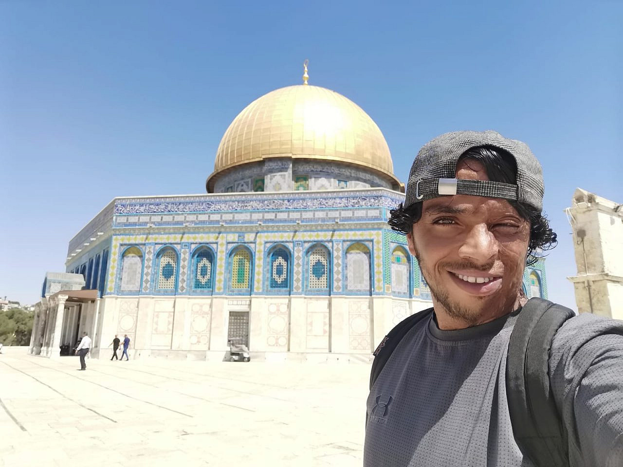 The author in front of the Dome of the Rock. (Awdah Hathaleen)