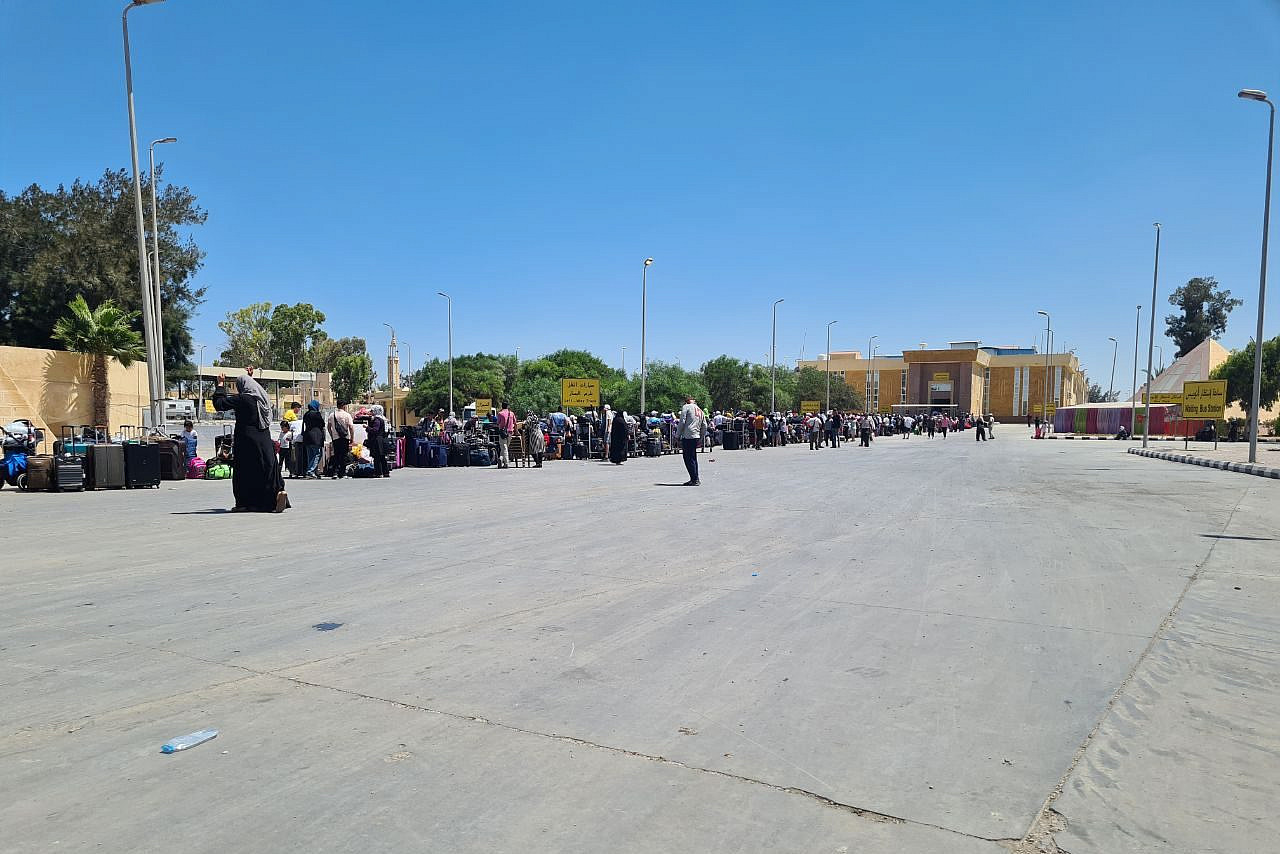 Palestinians stand in line at the Egyptian side of the Rafah Crossing. (Hebh Jamal)