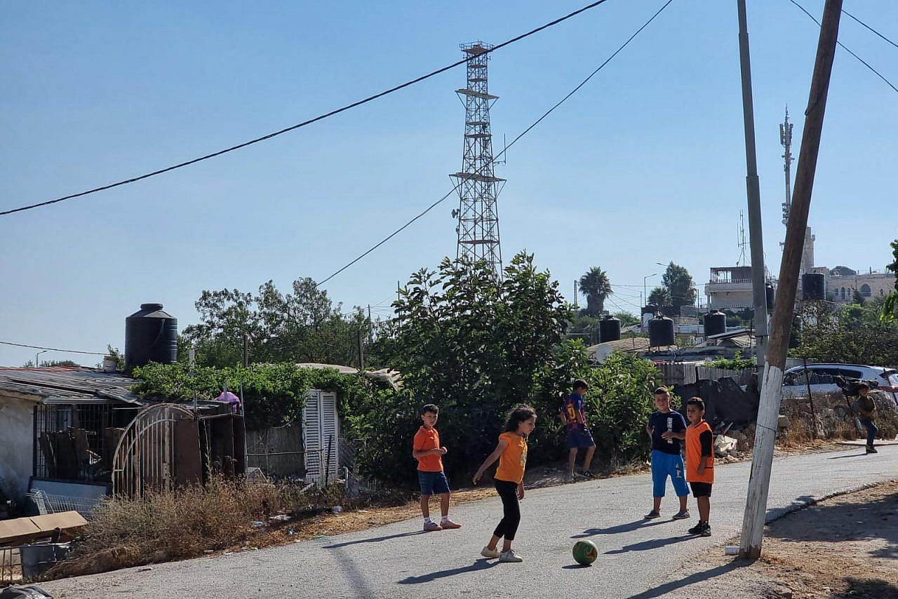 Palestinian children play football in the unrecognized village of An-Nabi Samwil, August 1, 2022. (Yuval Abraham)