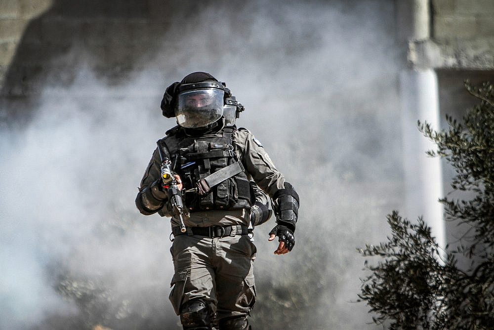 An Israeli soldier seen during the repression of a Palestinian protest against the Israeli outpost of Evyatar, in the village of Beita, near Nablus, occupied West Bank, February 18, 2022. (Nasser Ishtayeh/Flash90)