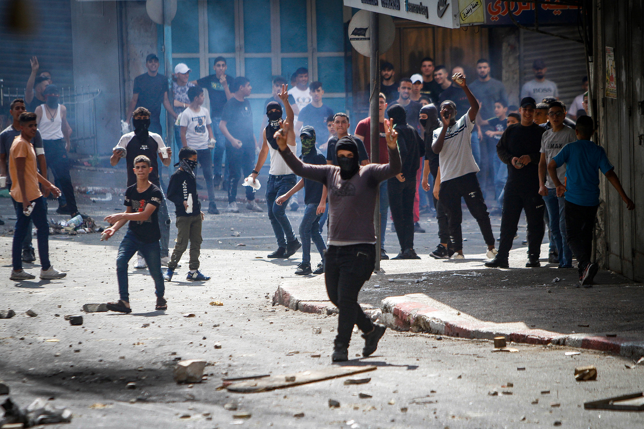 Palestinians clash with PA security forces in Nablus, in the West Bank on September 20, 2022, following the arrest of Hamas members by Palestinian security forces. (Nasser Ishtayeh/Flash90)