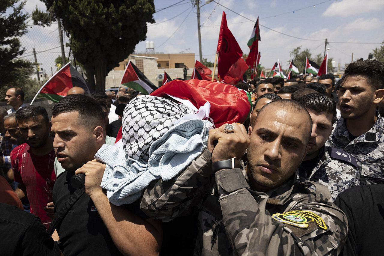 The funeral of Ali Harb, who was stabbed to death by an Israeli settler the previous day, in the village of Iskaka, occupied West Bank, June 22, 2022. (Oren Ziv/Activestills)