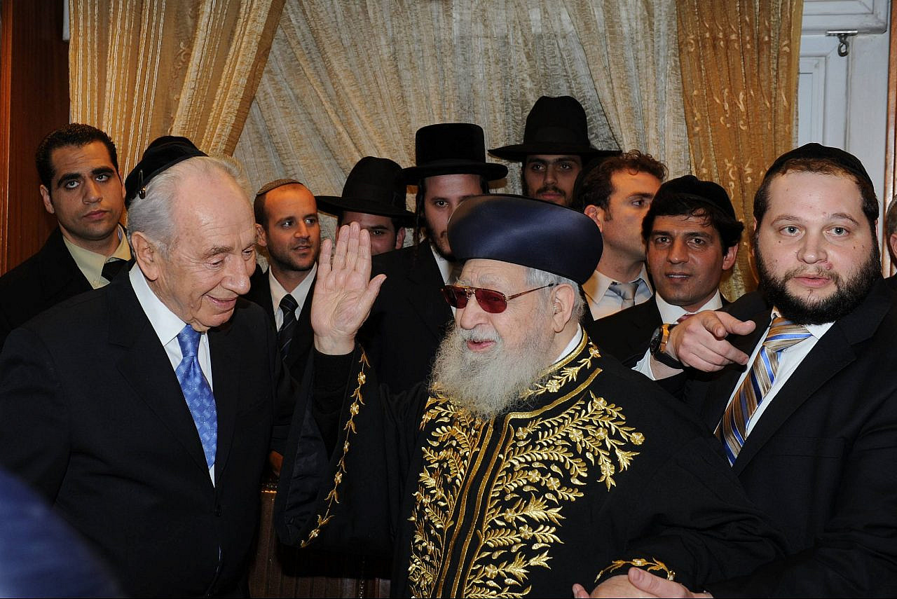 Rabbi Ovadia Yosef welcomes President Shimon Peres and others to the Bar Mitzvah celebrations of MK Eli Yishay's son at his home in Jerusalem, February 3, 2011. (Moshe Milner/GPO)