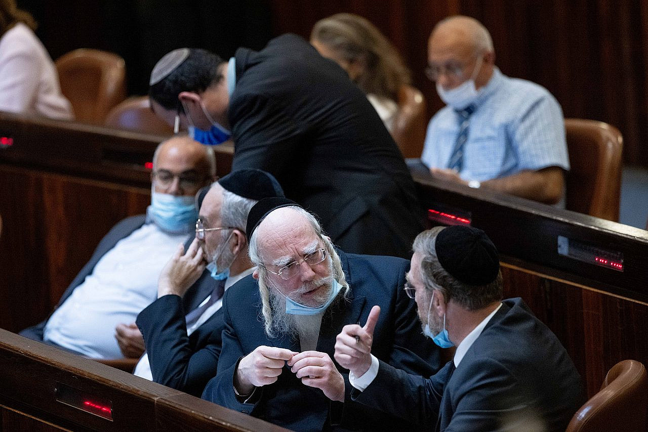 Politicians from the United Torah Judaism party seen during a plenum session in the assembly hall of the Israeli Knesset, Jerusalem, October13, 2021. (Yonatan Sindel/Flash90)