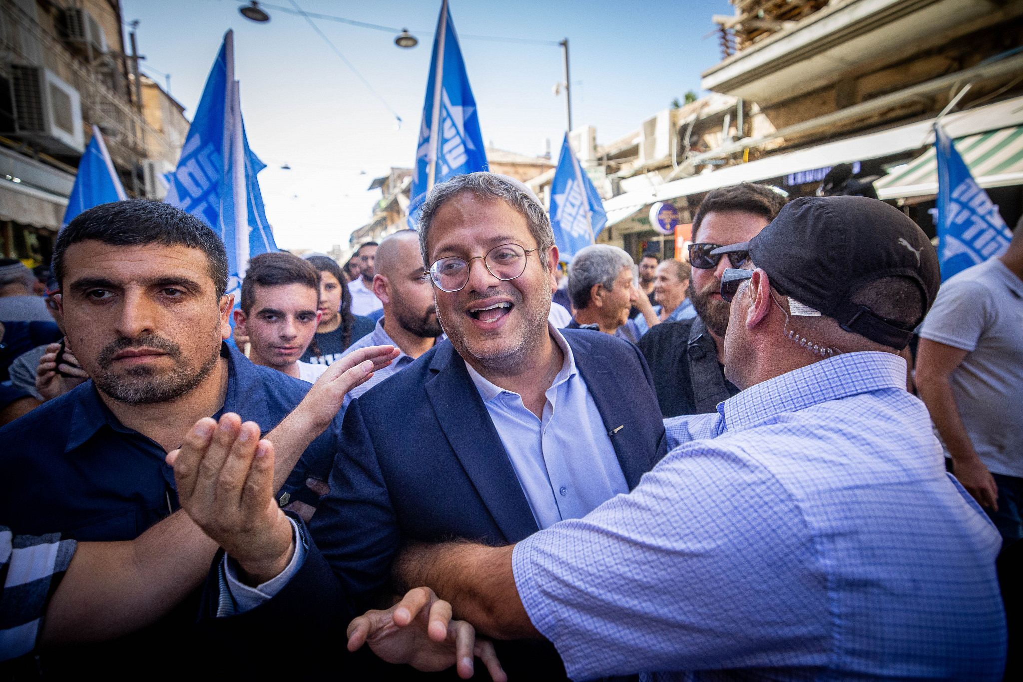 MK Itamar Ben Gvir of the far right Otzma Yehudit party tours at the Mahane Yehuda market in Jerusalem, September 30, 2022. (Yonatan Sindel/Flash90)