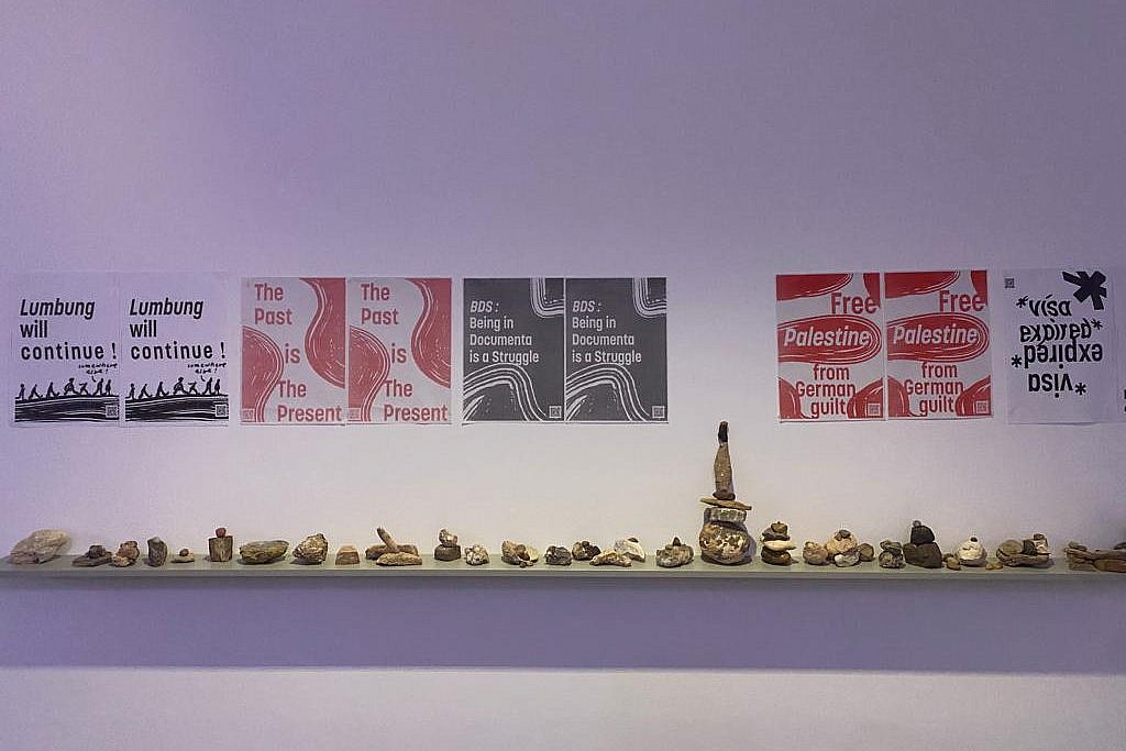 Posters on display in the exhibition venues of the documenta fifteen festival protest the publication of a 'scientific report' accusing Palestinian artists and collectives of antisemitism, Kassel, Germany, June-September, 2022. (Courtesy)