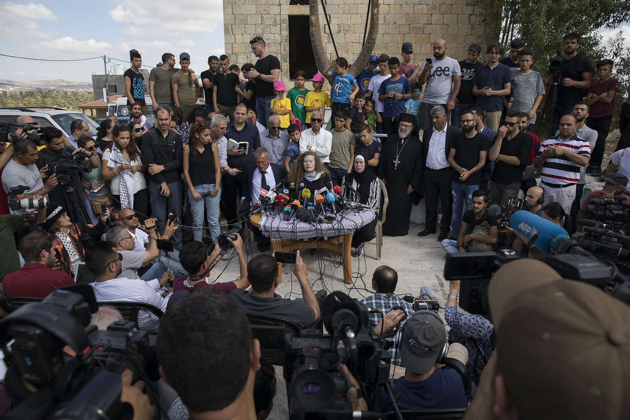 Palestinian youth activist Ahed Tamimi and her family hold a press conference in their home village of Nabi Saleh, following their release from an Israeli prison after an eight-month sentence, July 29, 2018. (Oren Ziv/Activestills)