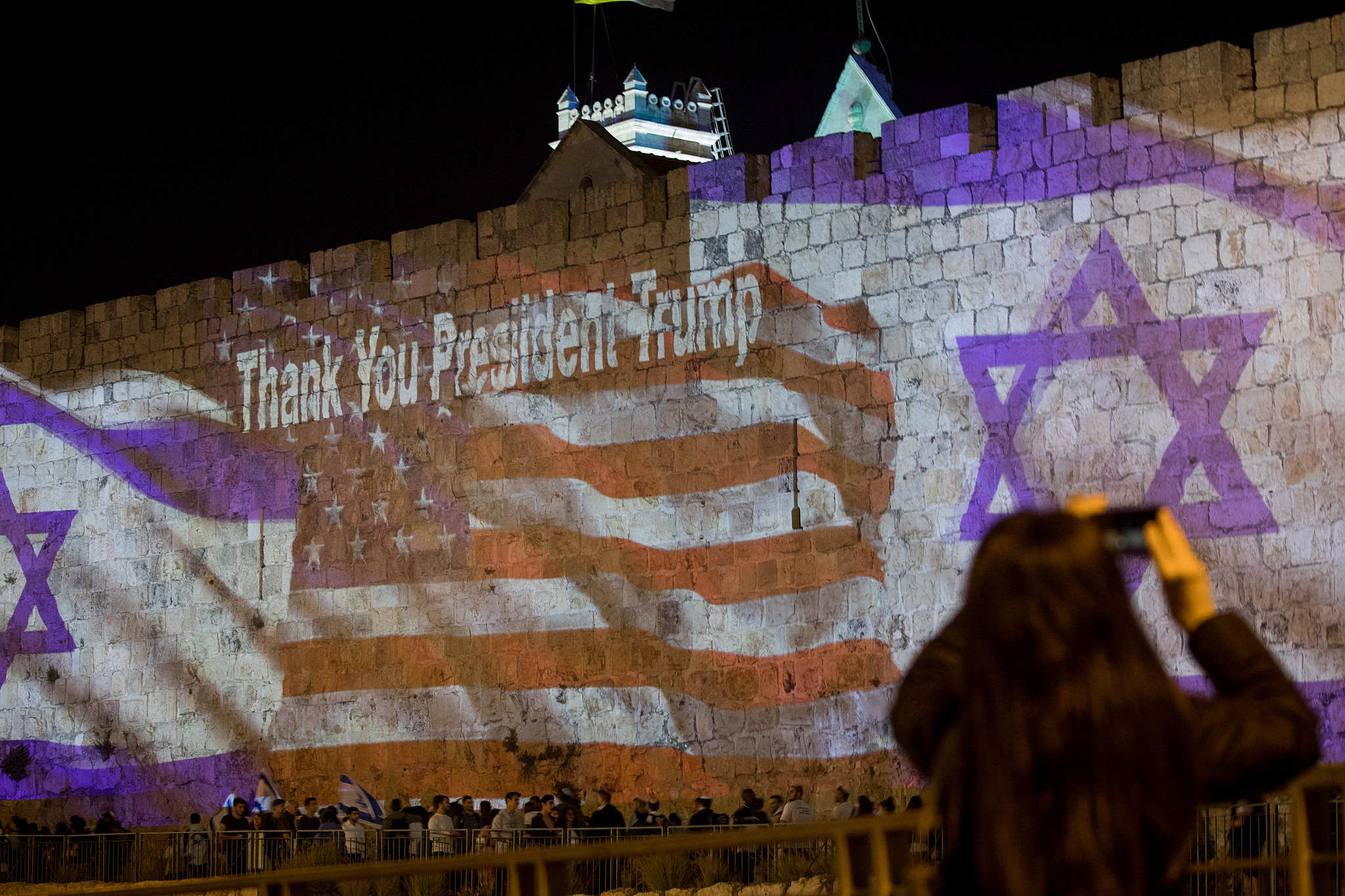 The Israeli and the American flags are screened on the walls of Jerusalem's Old City, ahead of the opening of the US embassy in Jerusalem, May 13, 2018. (Yontan Sindel/Flash90)
