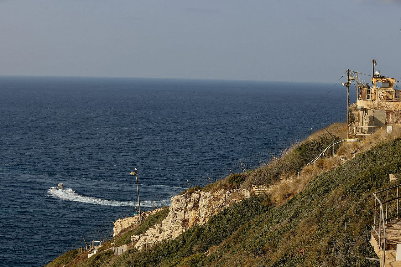 A Lebanese navy boat sails near a United Nations ship off the coast of Rosh HaNikra, on the border between Israel and Lebanon, October 27, 2022. (David Cohen/Flash90)