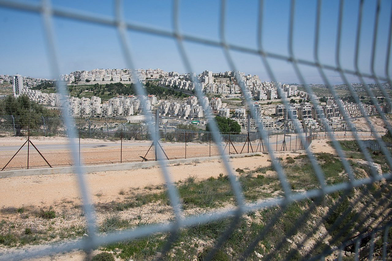 The Israeli separation barrier passes near the settlement of Har Homa, on what was once the Abu Ghneim forest on land belonging to the town of Beit Sahour, occupied West Bank, March 31, 2014. (Ryan Rodrick Beiler/Activestills)