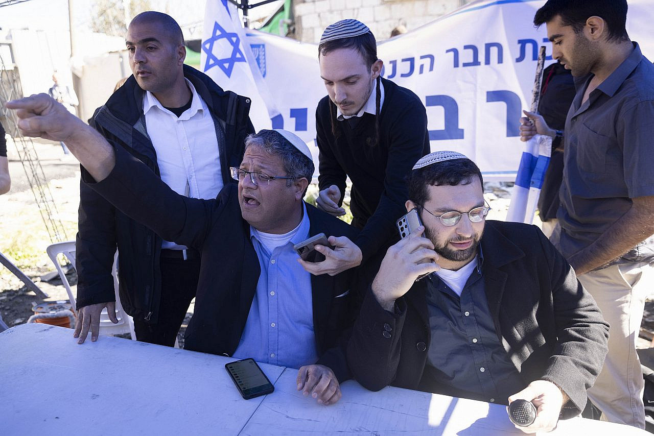 Itamar Ben-Gvir sets up a makeshift parliamentary office outside the house of the Salem family, threatened with eviction in favor of settlers, in the east Jerusalem neighborhood of Sheikh Jarrah, February 13, 2022. (Oren Ziv)