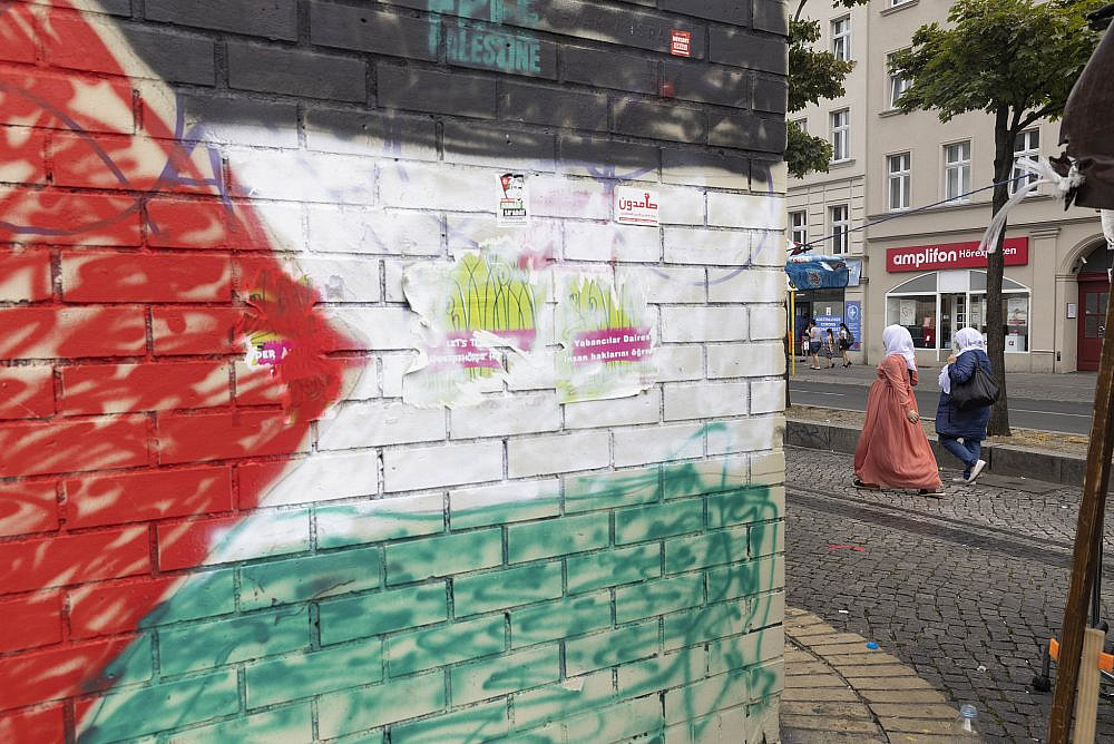 Posters and murals supporting the Palestinian struggle in the neighborhood of Neukölln in Berlin, Germany, July 21, 2022. (Oren Ziv)
