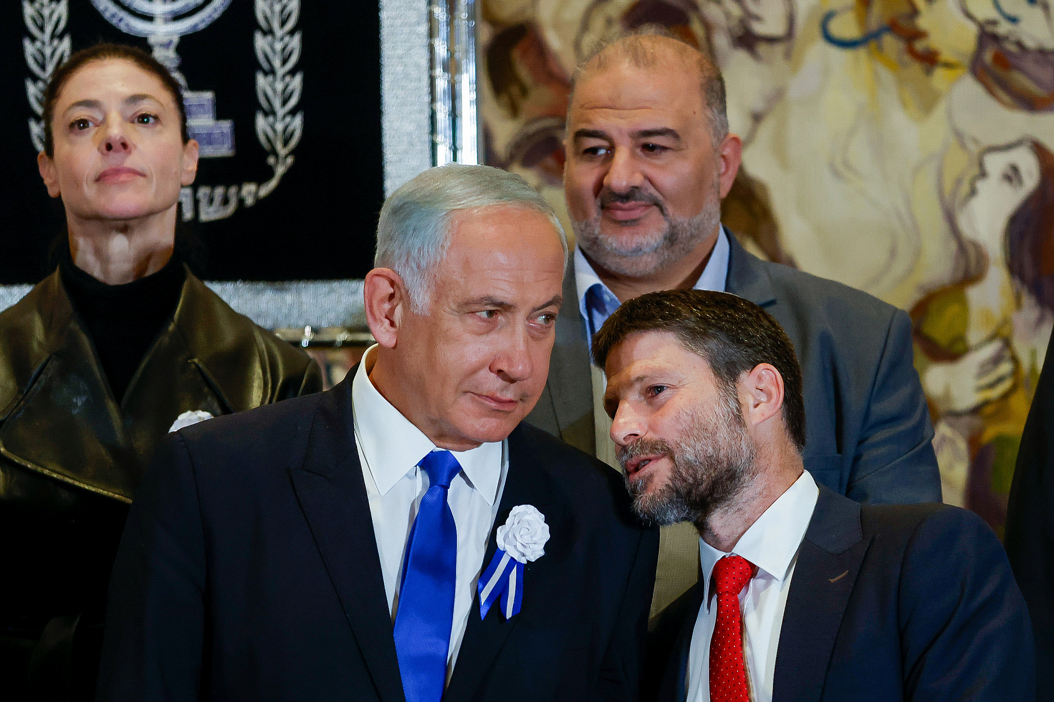 Likud leader MK Benjamin Netanyahu speaks with Religious Zionist party head MK Bezalel Smotrich at a swearing-in ceremony of the 25th Knesset, at the Israeli parliament in Jerusalem, November 15, 2022. (Olivier Fitoussi/Flash90)