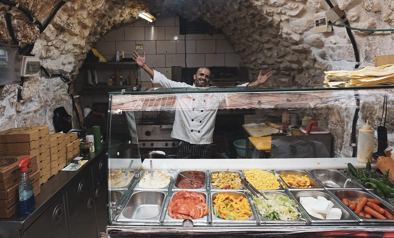 A vendor on Izzeldin Bukhari's Sacred Cuisine tour, Old City of Jerusalem. (Alice Austin)